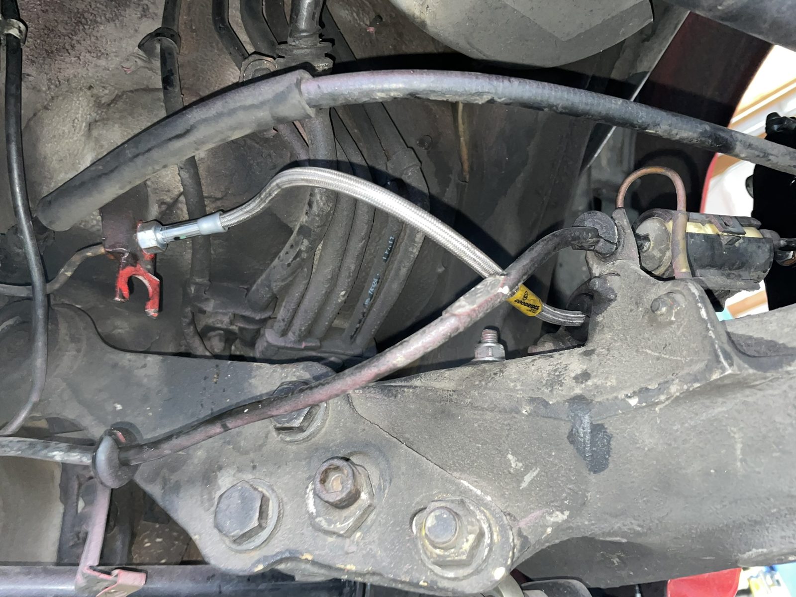 Factory Porsche 964 brake line, hard line and mounting bracket before modification