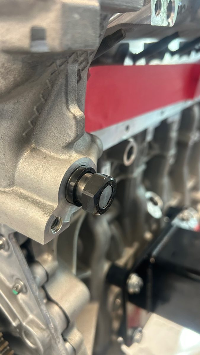 S58 crankshaft nose with conventional four-bolt damper mount, unlike the S55 single-bolt crank hub