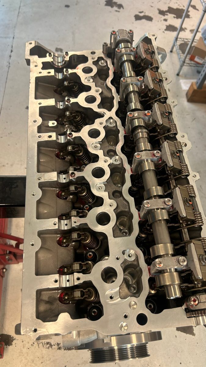 S58 cylinder head reassembled with camshafts and cam caps torqued to spec