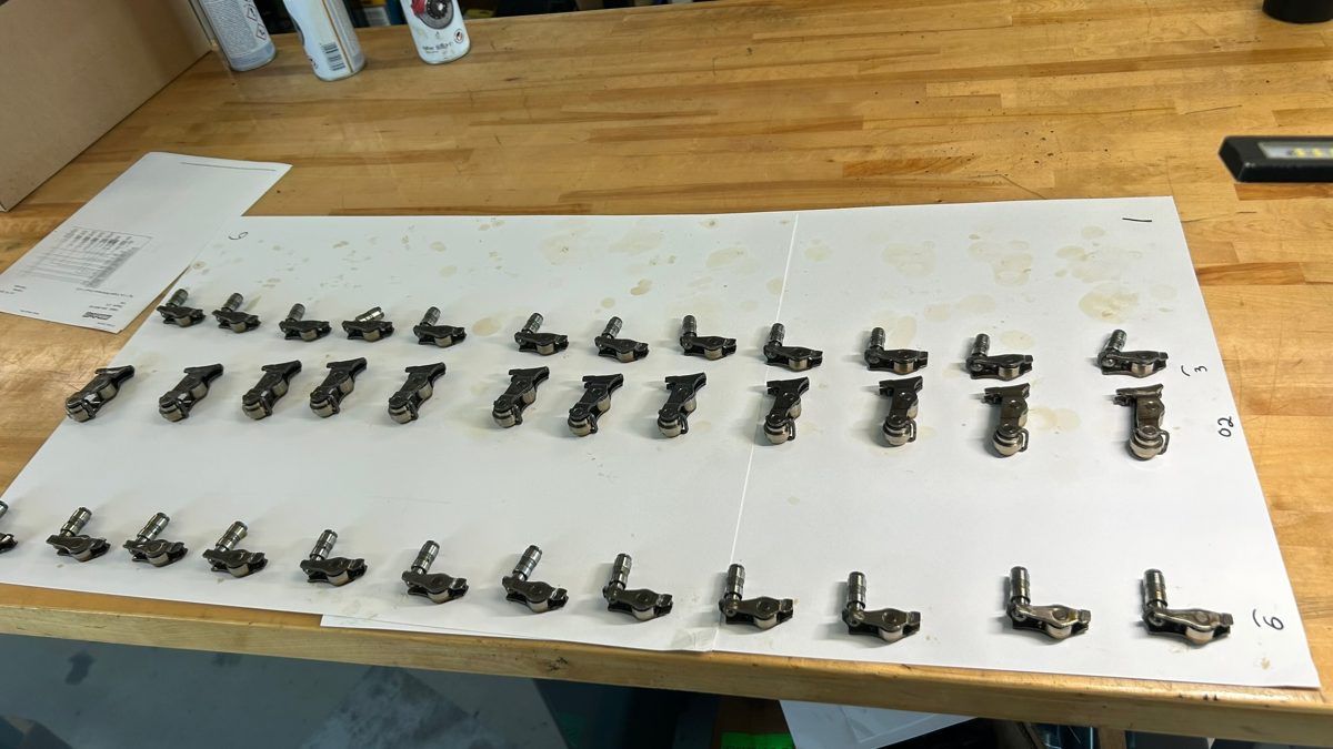 S58 rod bolts and cam cap bolts laid out in numbered position order for measurement